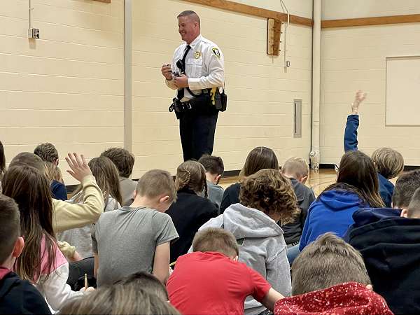 Chief Markle speaking with students at Hickory Grove as part of the DARE program.